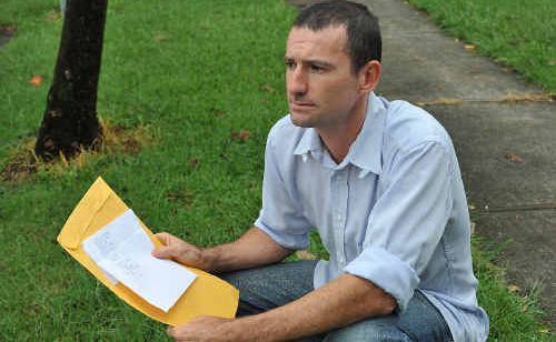 Cr Mark Graham and the hand written death threat. Cr Mark Graham and the hand written death threat.